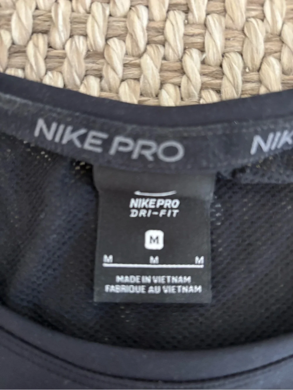 Nike Pro Black Cropped Tank with Pink-to-Blue Gradient Logo